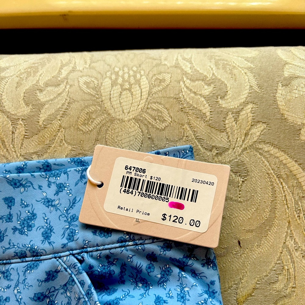 Golf skort a pretty blue pattern.  Waist 28”, hips 34”, length 19”